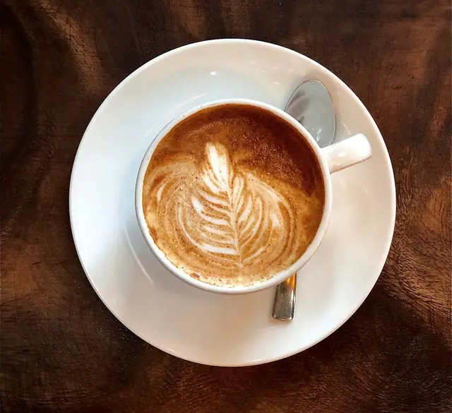 A latte in a stoneware cup